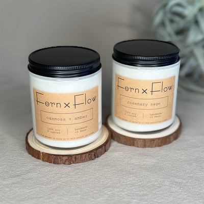 Fern x Flow Earthy Essentials vegan soy candle bundle and gift set featuring Oakmoss + Amber and Rosemary Sage scented soy candles.